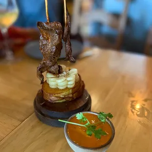 a plate of food on a wooden table