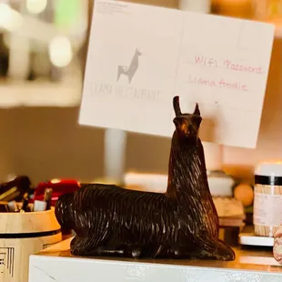 a llama statue on a counter