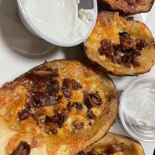 a plate of bacon and cheese toasts