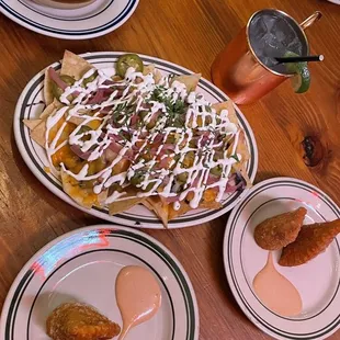 Happy hour - Mac and Cheese Nachos Cheesesteak Empanadas