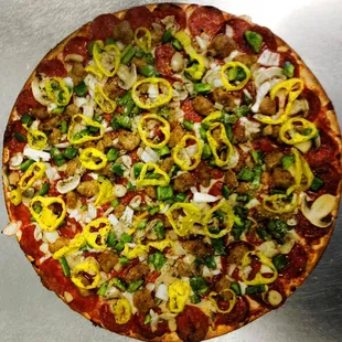 a pizza with sausage and peppers