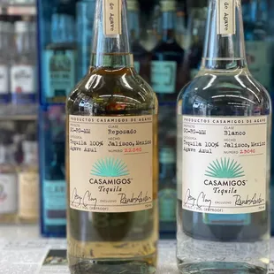 two bottles of liquor on a table