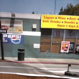 a view of the outside of a liquor shop