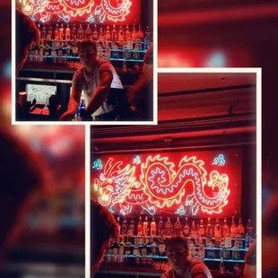 a man sitting in front of a bar