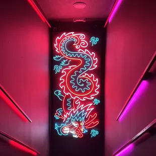 a neon sign in a dark room