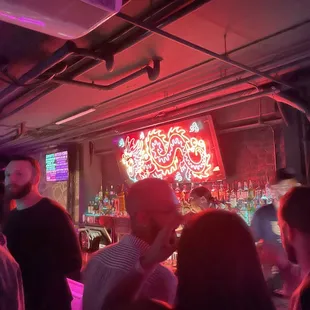 a crowd of people at a bar