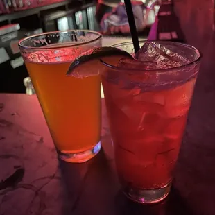 two cocktails on a bar counter