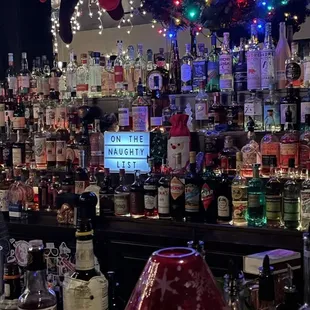 a bar filled with bottles of alcohol
