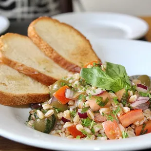 The Insalata di farro is made with whole-grain wheat farro, olives, tomatoes and basil.