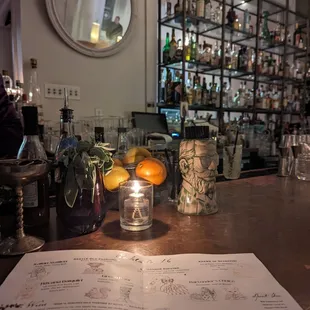 a menu and a lit candle