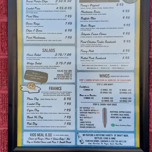 a menu on a brick wall