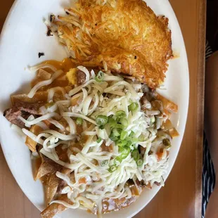 a plate of noodles and meat