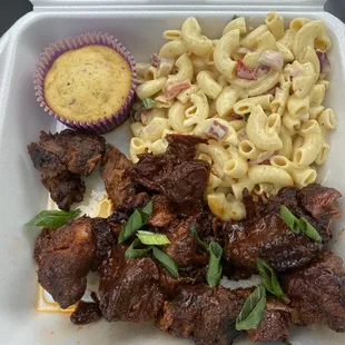 Burnt Pork Ends with macaroni salad and cornbread