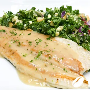 Grilled Trout with Thyme and Lemon Velouté  served with Fruity and nutty Kale Salad with honey Dijon dressing.