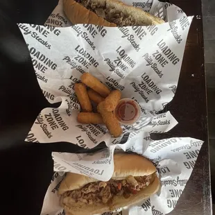 Large cheesesteak no onions.  Mozzarella sticks with marinara. Pepper chicken cheesesteak.