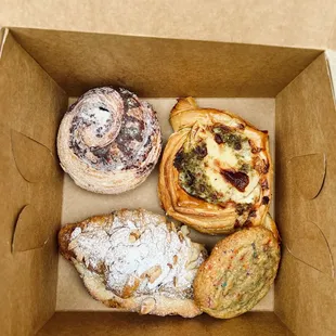 Raspberry morning bun, pesto &amp; potato danish, almond croissant, and ruby sprinkle chocolate chip cookie