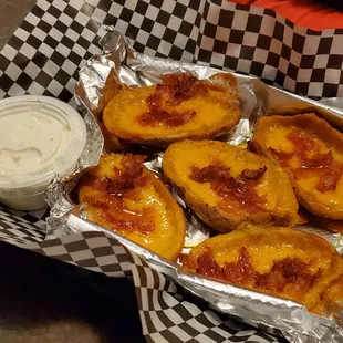 a tray of baked potato skins