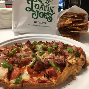 a slice of pizza on a plate