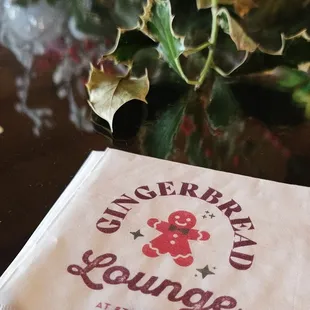 a napkin with a gingerbread lounge logo