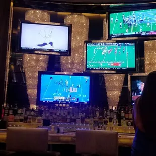 people watching televisions on large screens