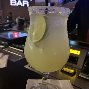 a margarita with a lime slice on the rim