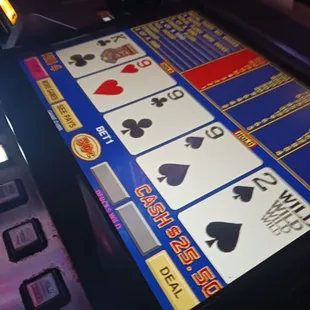 a slot machine with playing cards