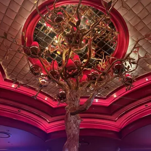 a chandelier with a tree in the center