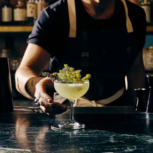 a bartender preparing a cocktail