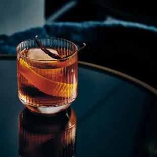 a glass of old fashioned cocktail