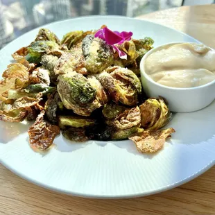 Crispy Brussels Sprouts. Portion size is large! These crispy little things are delicious. Comes with a small bowl garlic aioli.