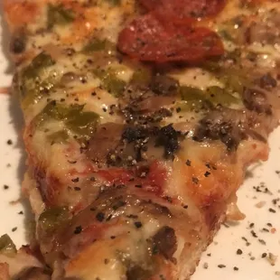 The &quot;supreme&quot; pizza with pepperoni, green peppers, and mushrooms.