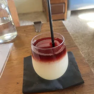 Frozen white wine sangria with some Tempranillo on top. Excellent!