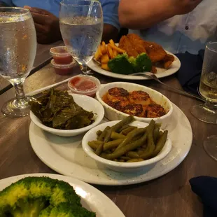 a plate of broccoli and other foods