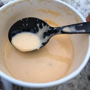 a spoon full of liquid