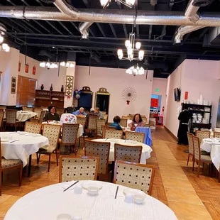 a dining room with tables and chairs