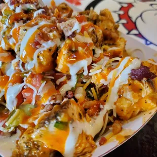 a plate of loaded nachos