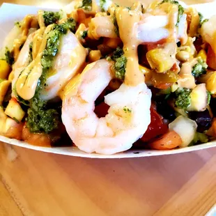 a plate of shrimp and broccoli