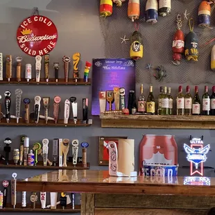 a bar with a lot of bottles on the wall