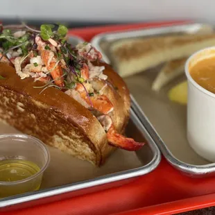 connecticut style lobster roll and a cup of bisque