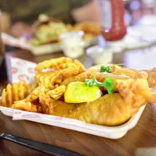 Fish &amp; Chips $12 "crispy, beer-battered with waffle fries, coleslaw and tartar sauce"