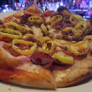 Artisan Pizzas:  A thin crust pizza baked in our high temperature oven with all of your favorite toppings.