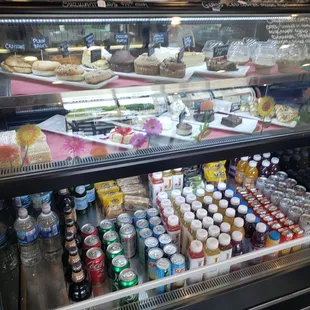 a deli case filled with drinks