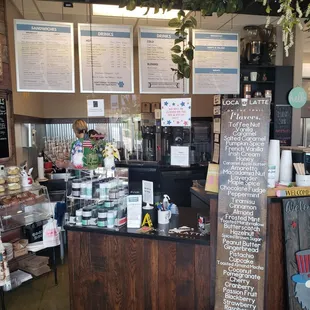 a coffee shop with menus on the wall