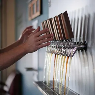 a man filling a beer from a tap