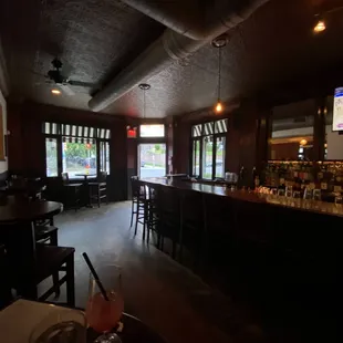 a bar with a large screen tv