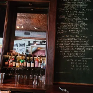 a menu on a blackboard in a bar