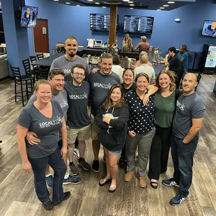 a group of people in a wine shop