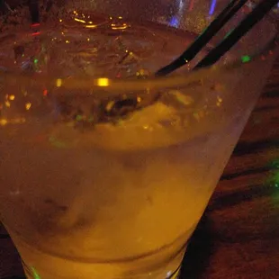 a drink in a glass on a table