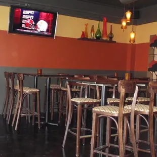 empty tables and chairs in a restaurant