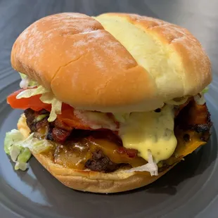 Bacado Burger - juicy bacon, avocado,  cheddar.